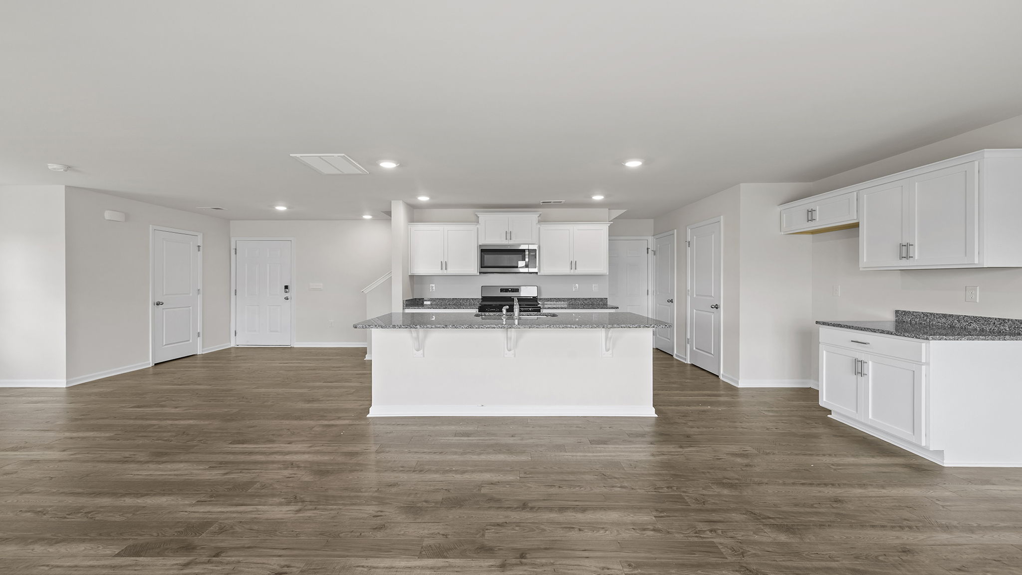 Kitchen with island and cabinets.