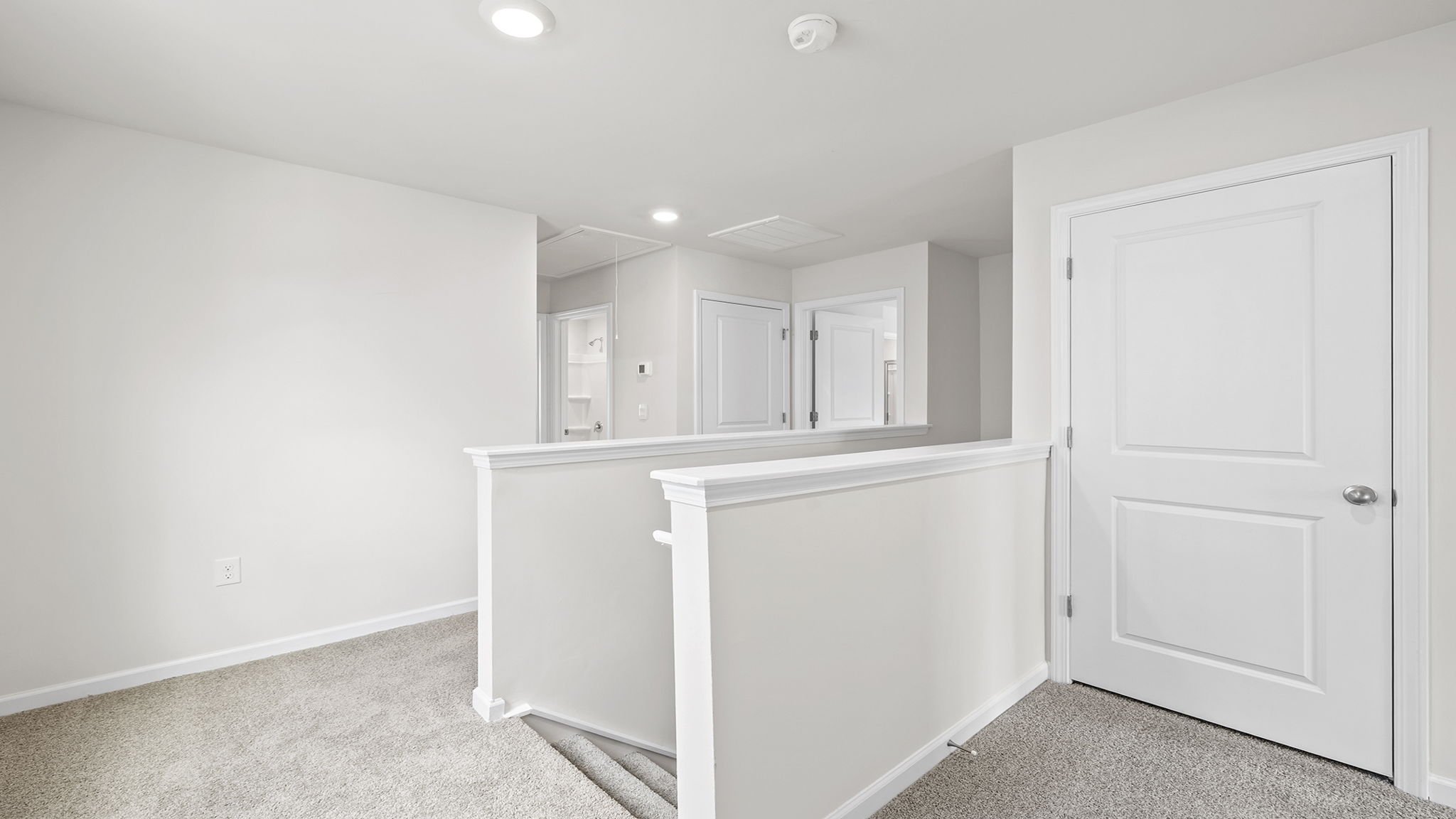 Loft area with carpet.