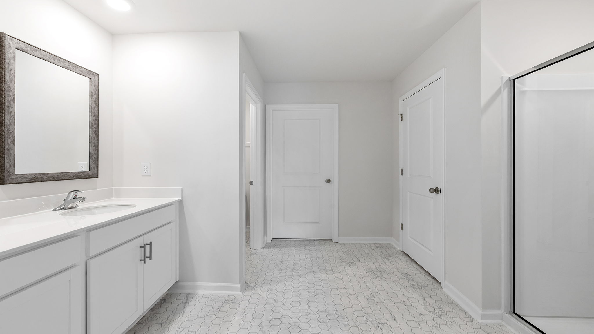 Primary bathroom with double vanity sink.