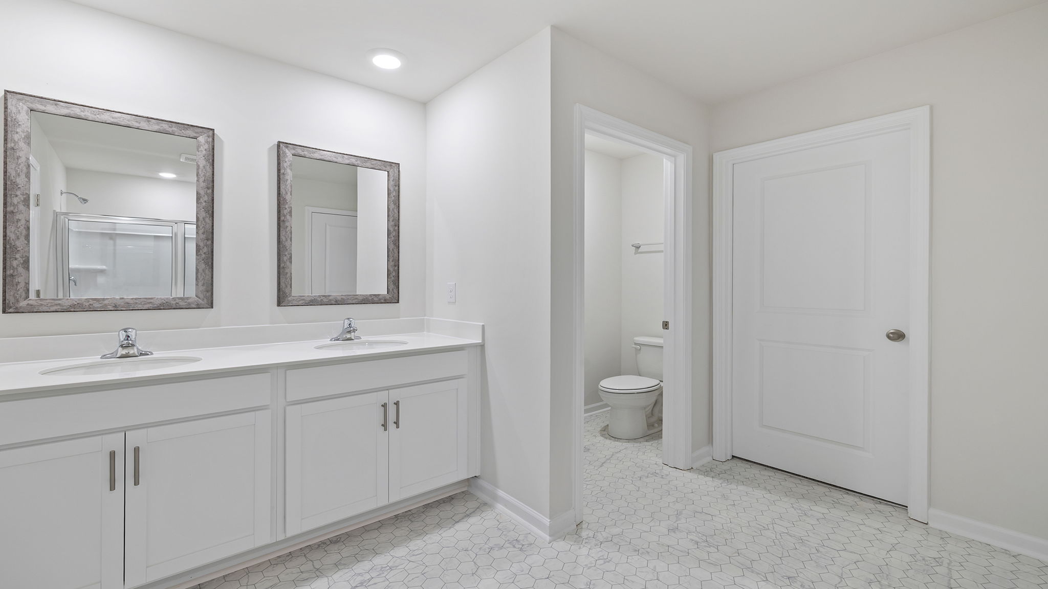 Primary bathroom with double vanity sink.