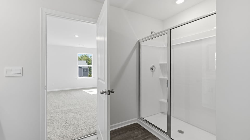 Bathroom with walk in shower.