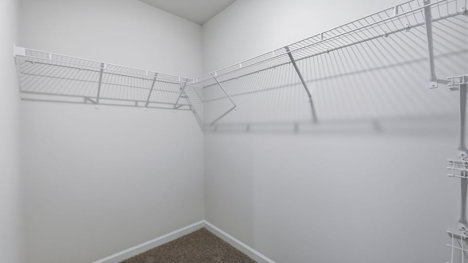 Closet with hanging storage racks.