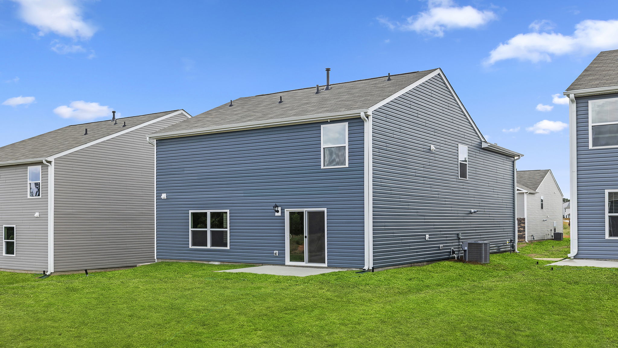 Back exterior with large backyard.