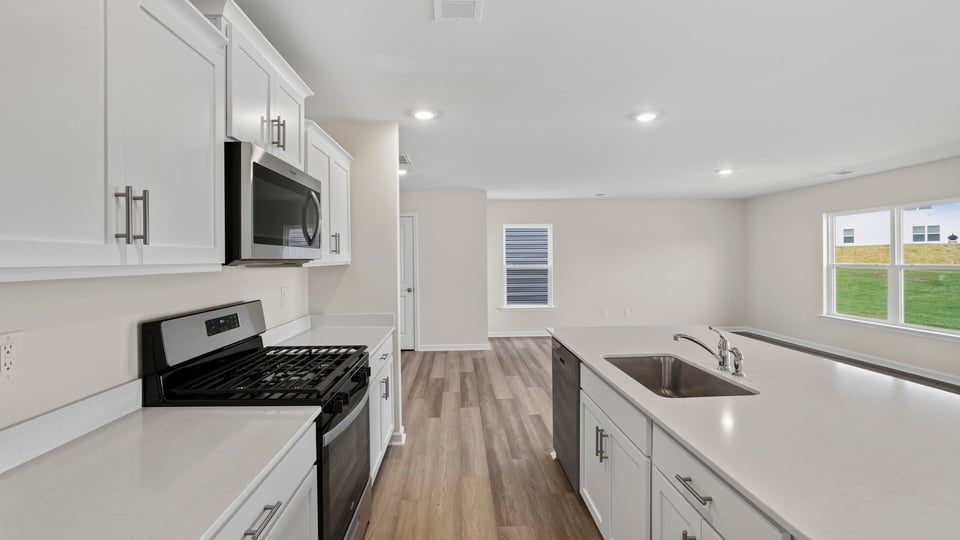 Kitchen with island and cabinets.