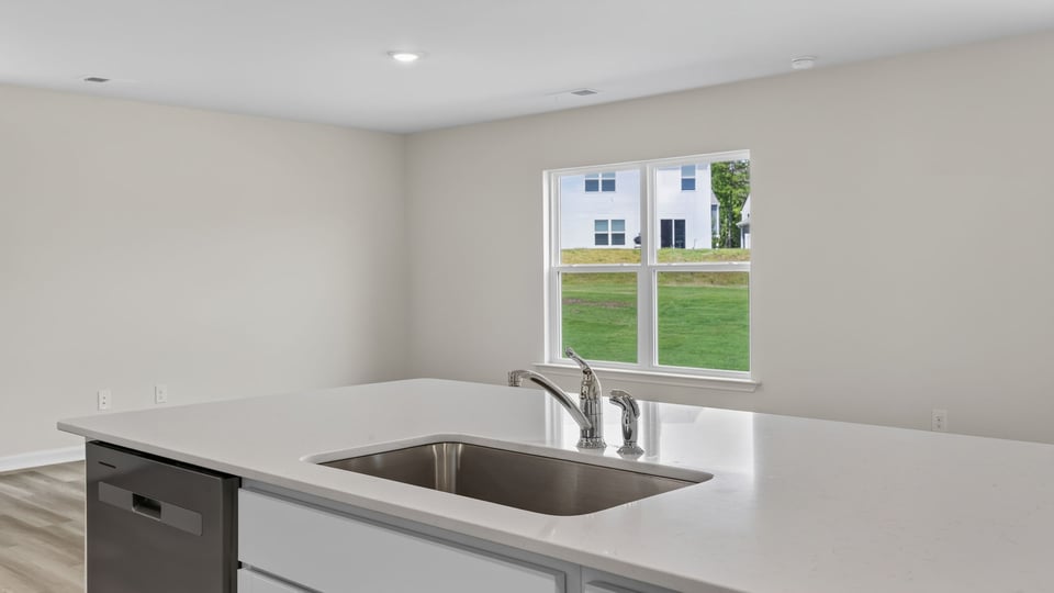 Kitchen with island and cabinets.