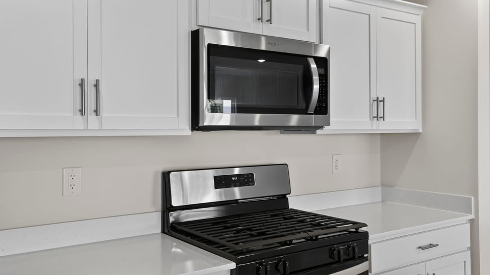 Kitchen with island and cabinets.