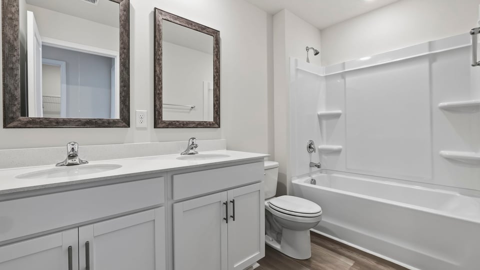 Bathroom with double vanity sinks.