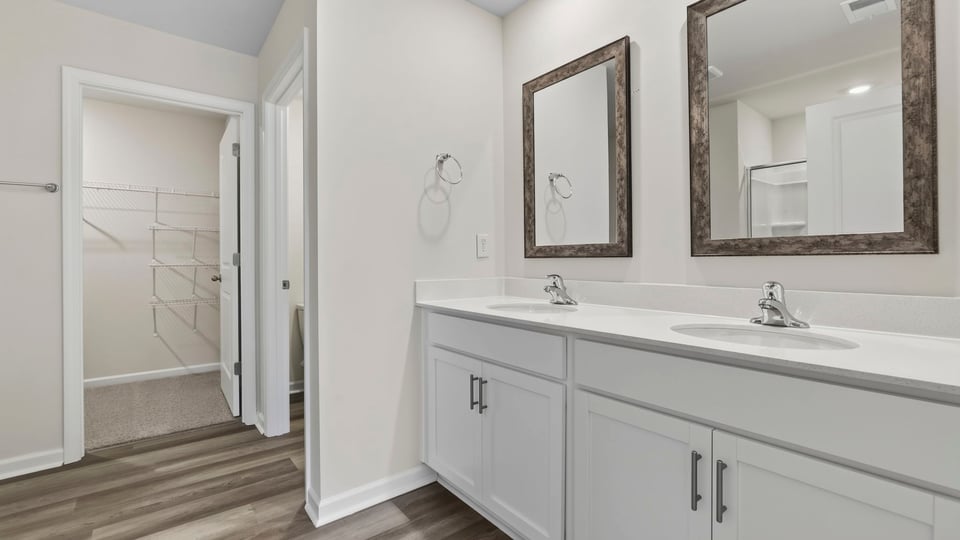 Primary bathroom with double vanity sinks.