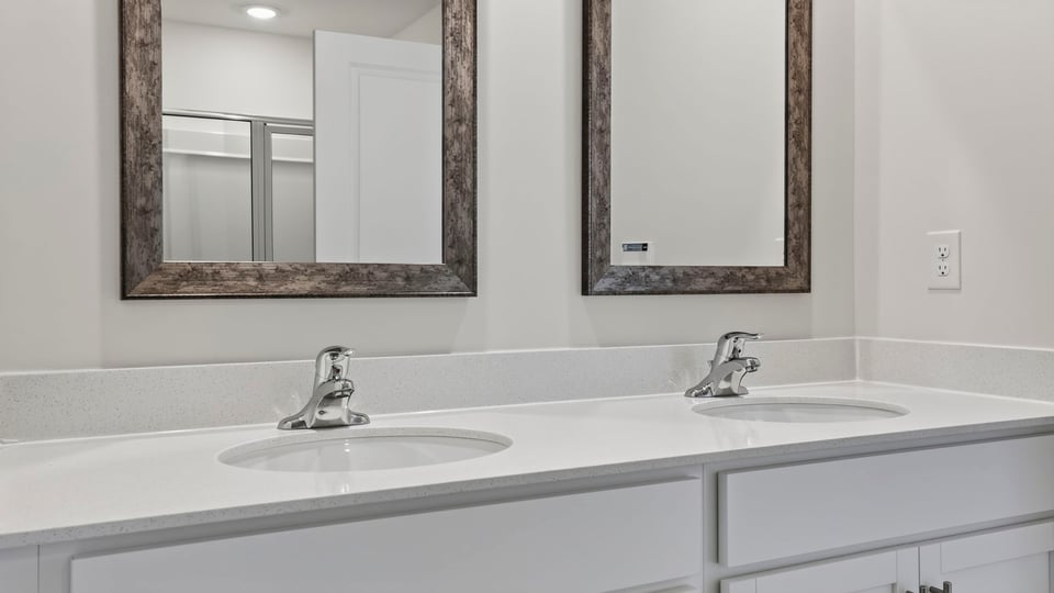 Primary bathroom with double vanity sinks.