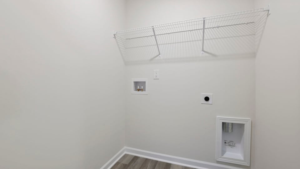 Laundry room with shelf.