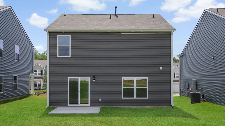 Back exterior with large backyard.
