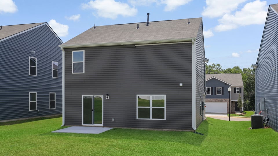 Back exterior with large backyard.