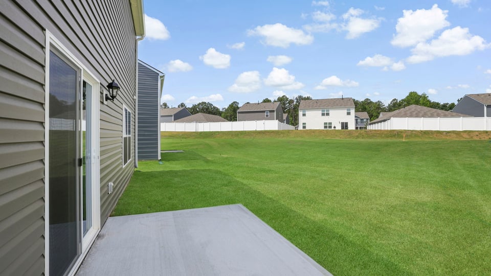 Back exterior with large backyard.