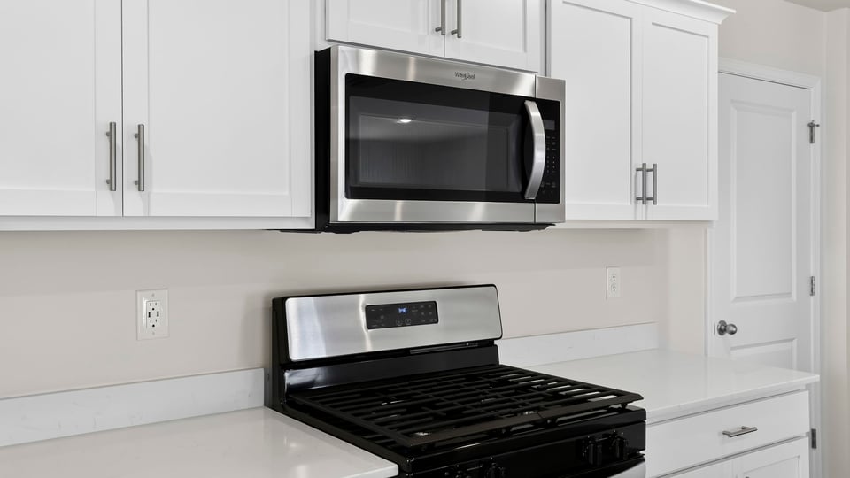 Kitchen with island and cabinets.