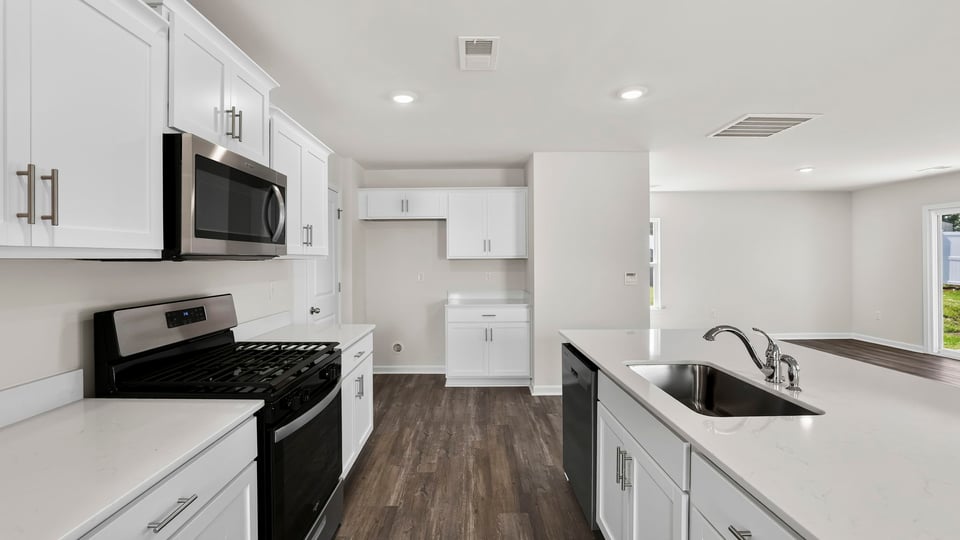 Kitchen with island and cabinets.