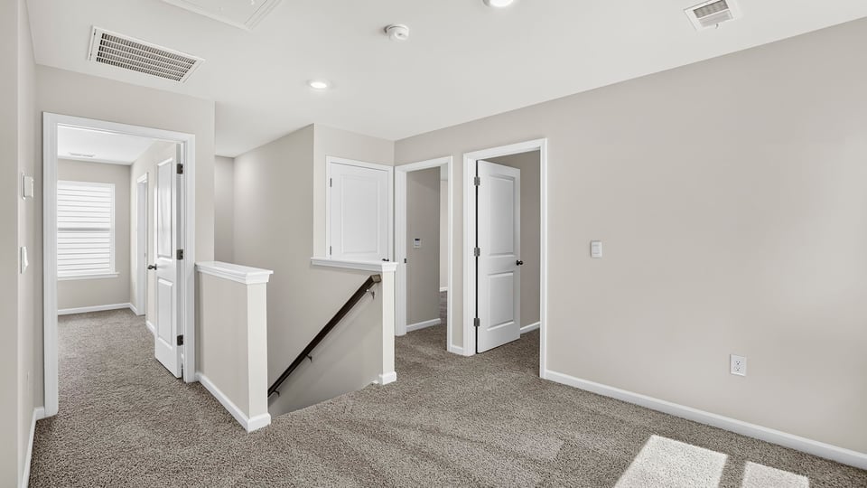 Loft area with carpet.