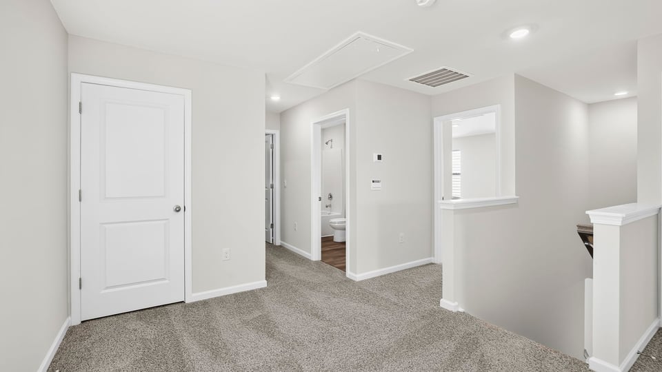 Loft area with carpet.