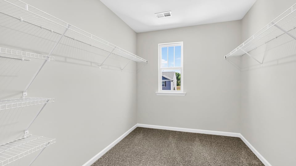 Primary closet with window.