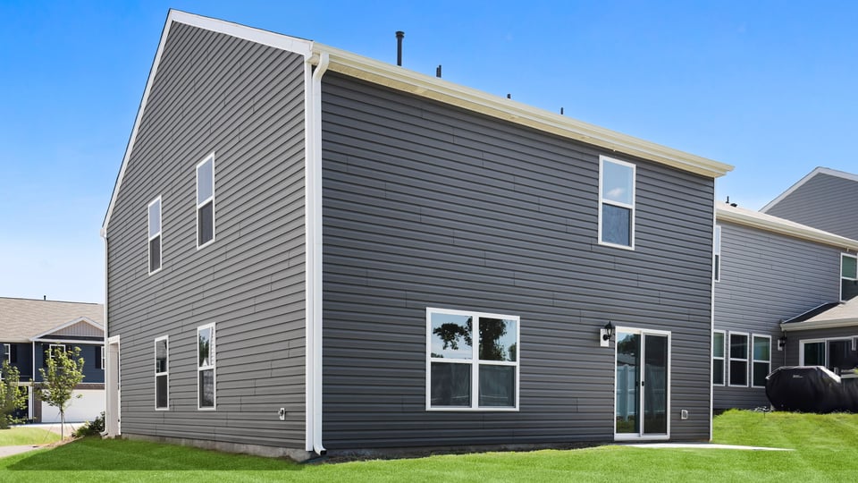 Back exterior with large backyard.