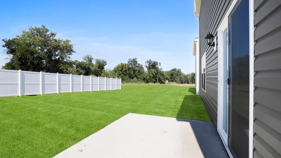 Back exterior with large backyard.