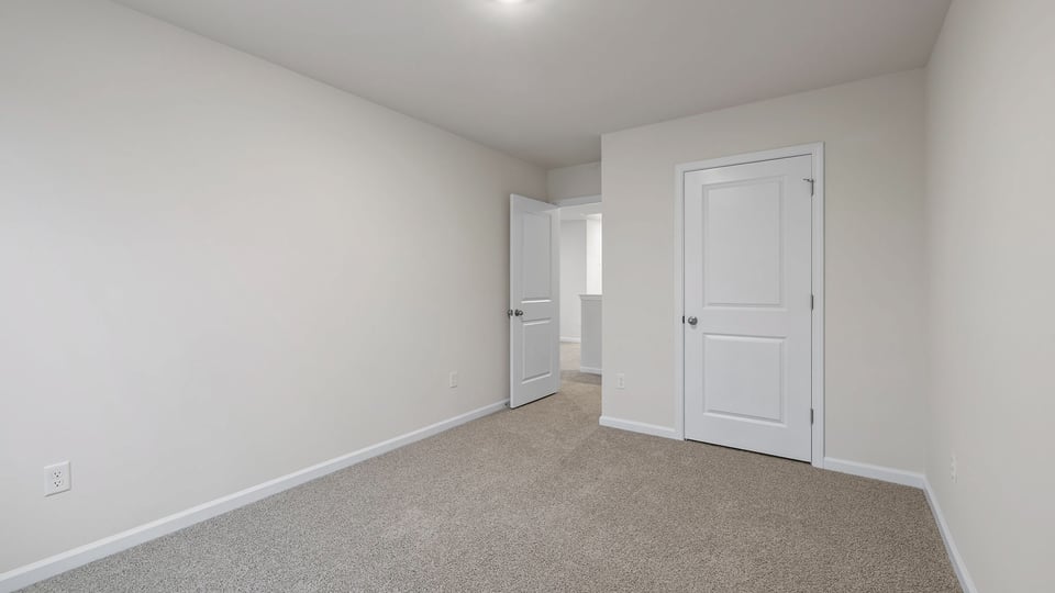 Bedroom with carpet.