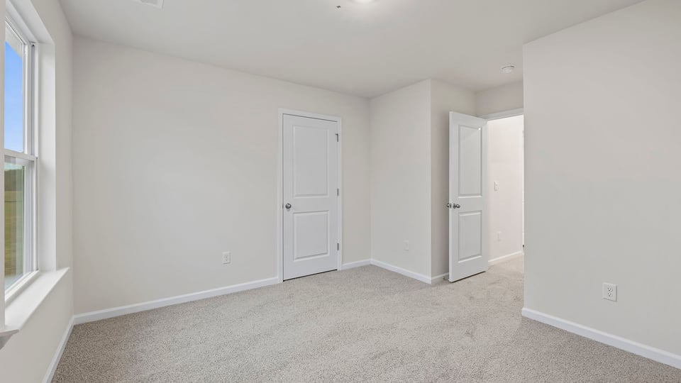 Bedroom with carpet.