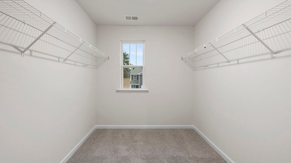 Primary walk-in closet.