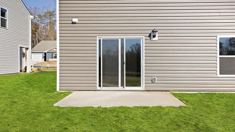 Back exterior with large backyard.
