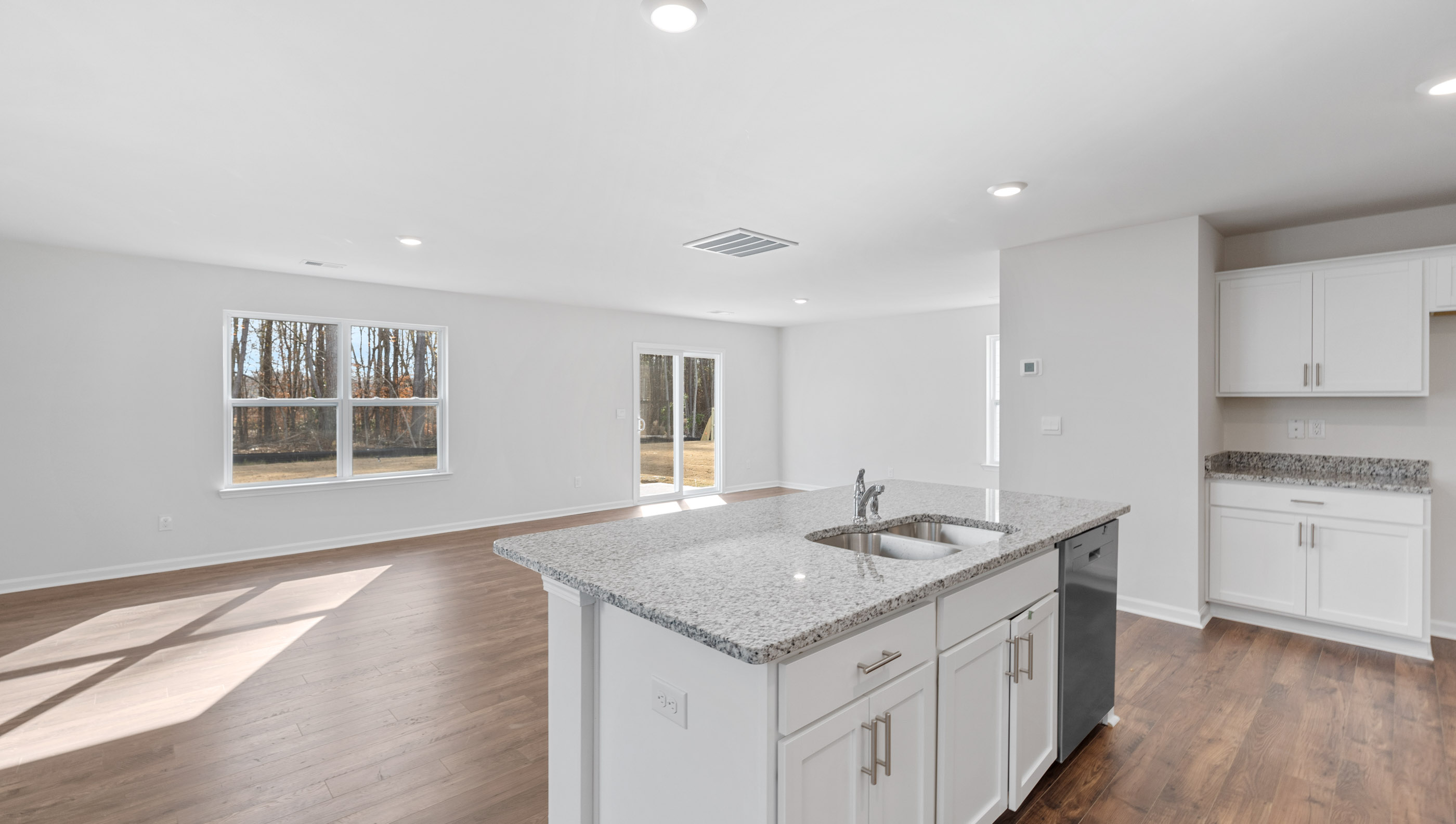 Kitchen with island and cabinets.