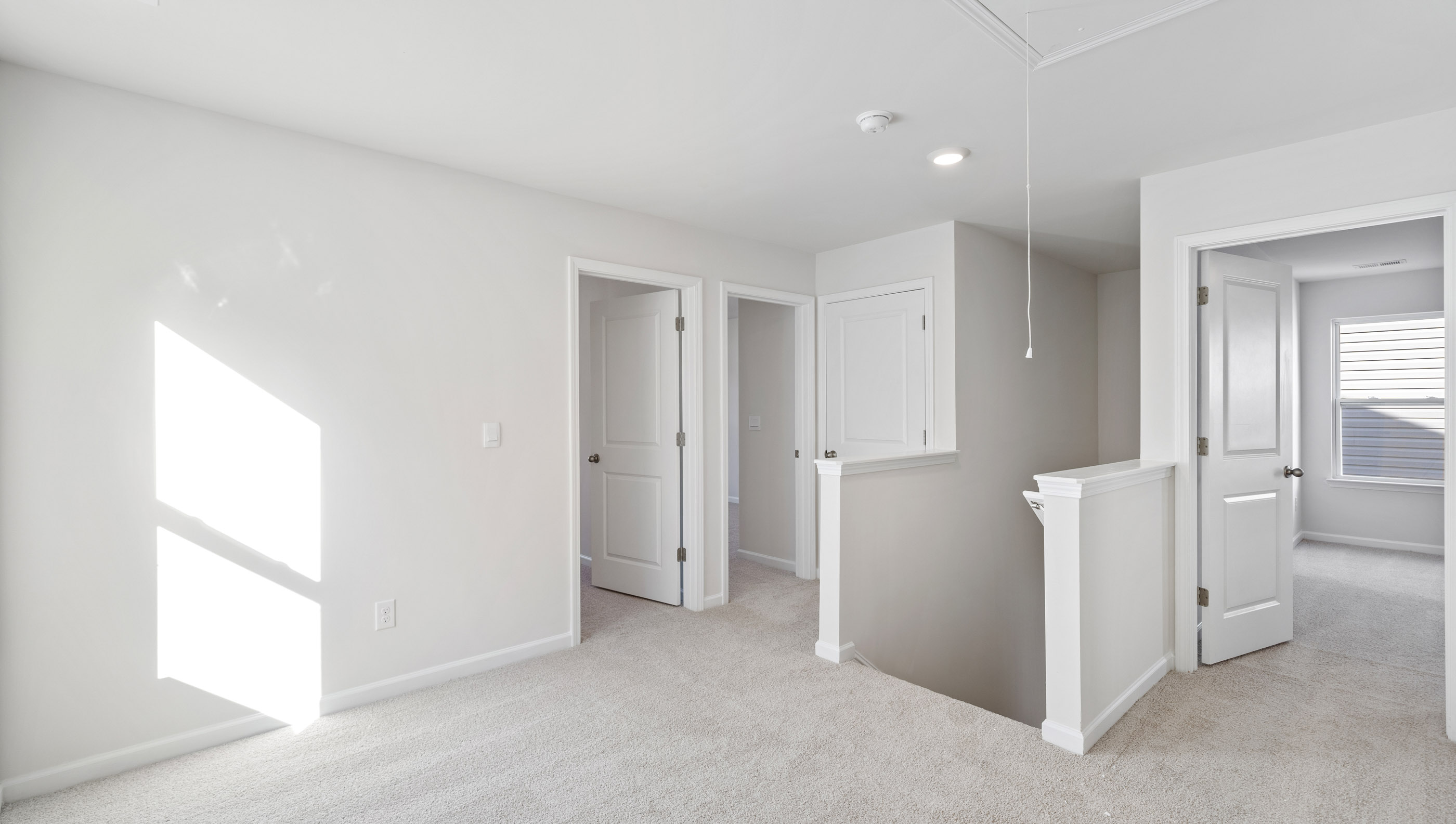 Loft area with carpet.
