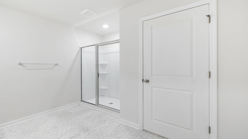 Primary bathroom with walk-in shower.