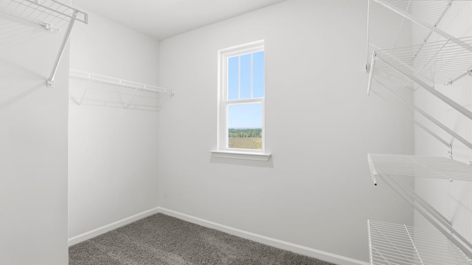 Primary closet with window.