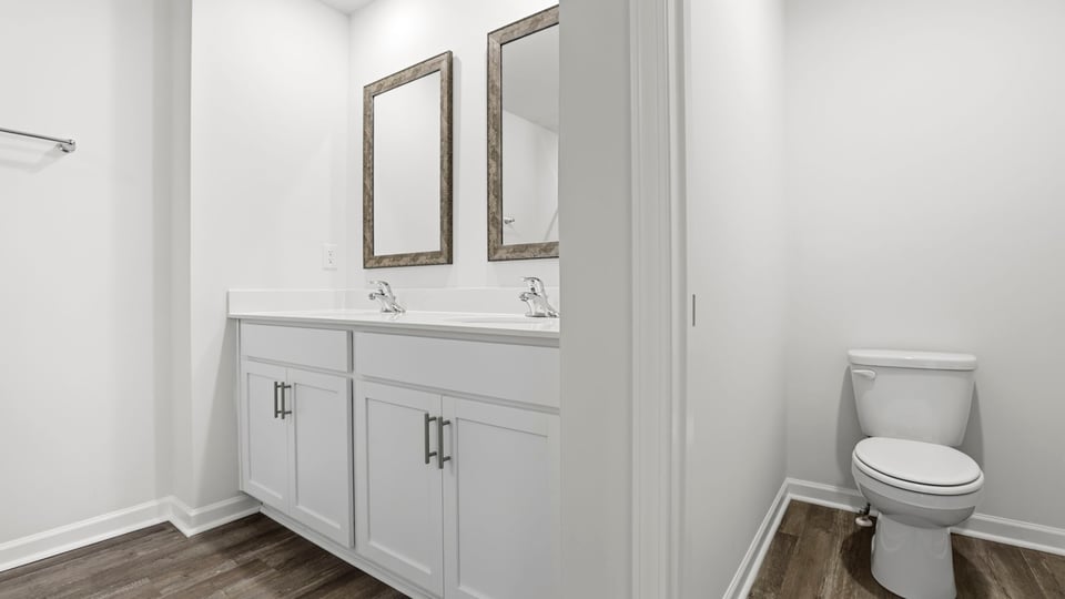 Primary bathroom with double vanity sinks.