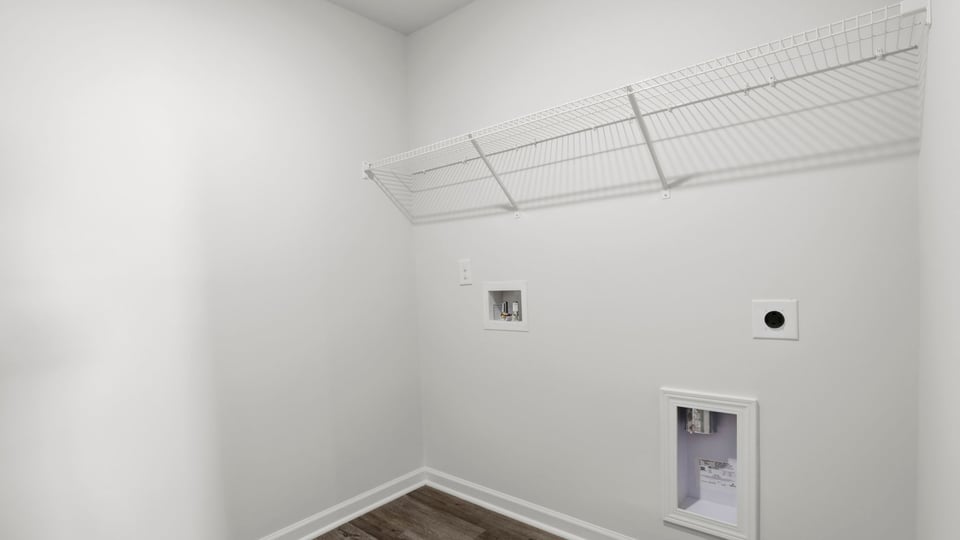 Laundry room with shelf.