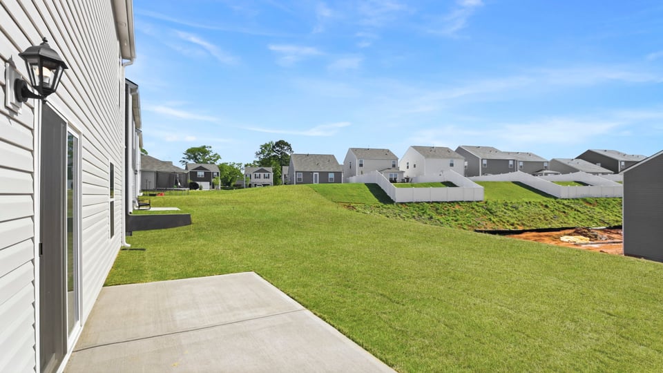 Back exterior with large backyard.