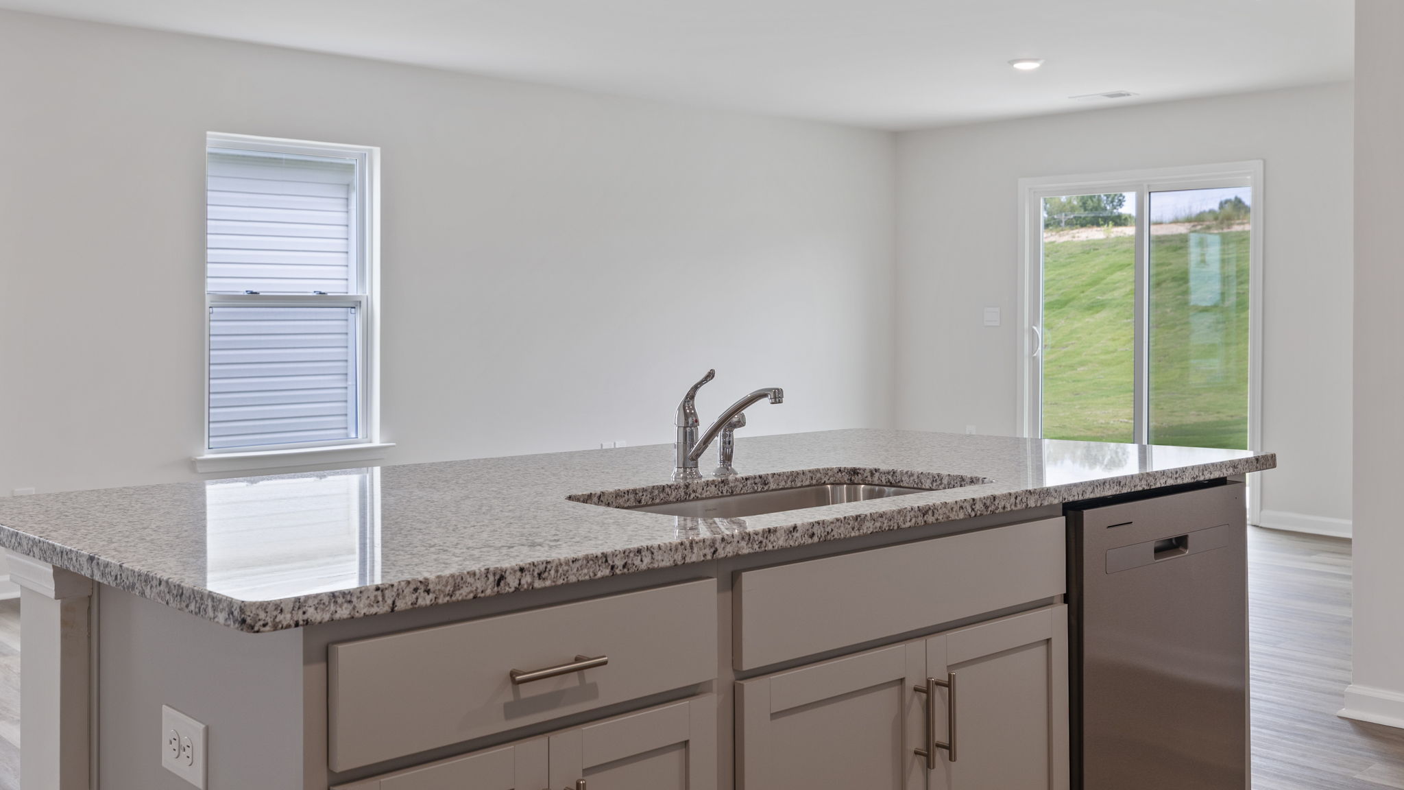 Island hosts the sink and dishwasher.