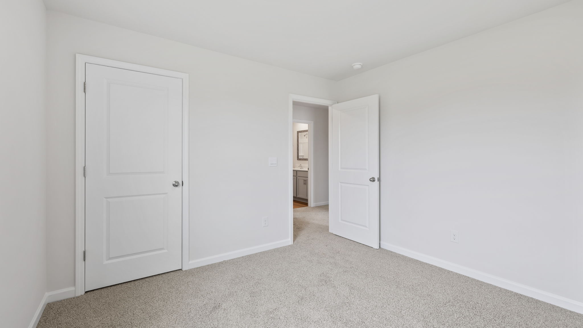 Bedroom with carpet.