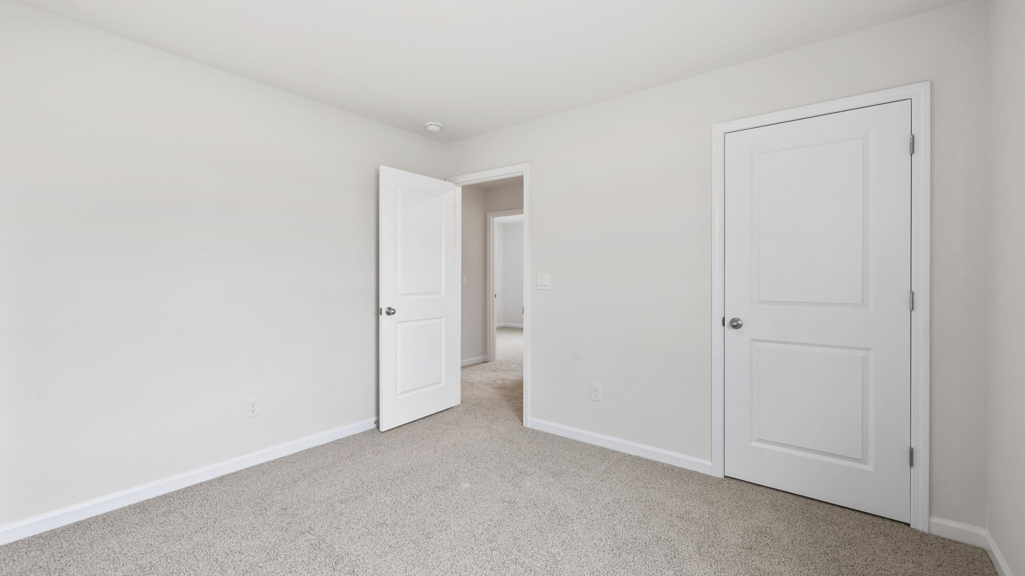 Bedroom with carpet.