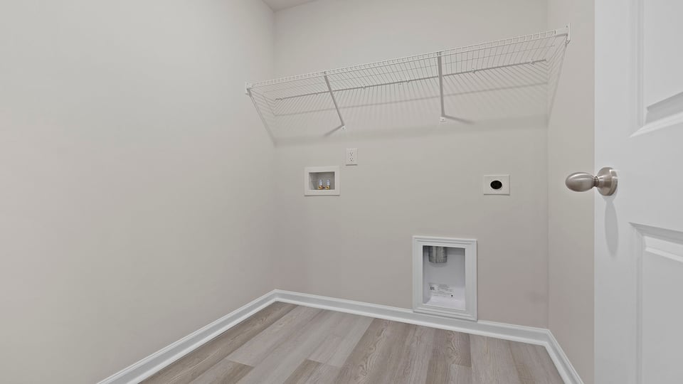 Laundry room with shelf.