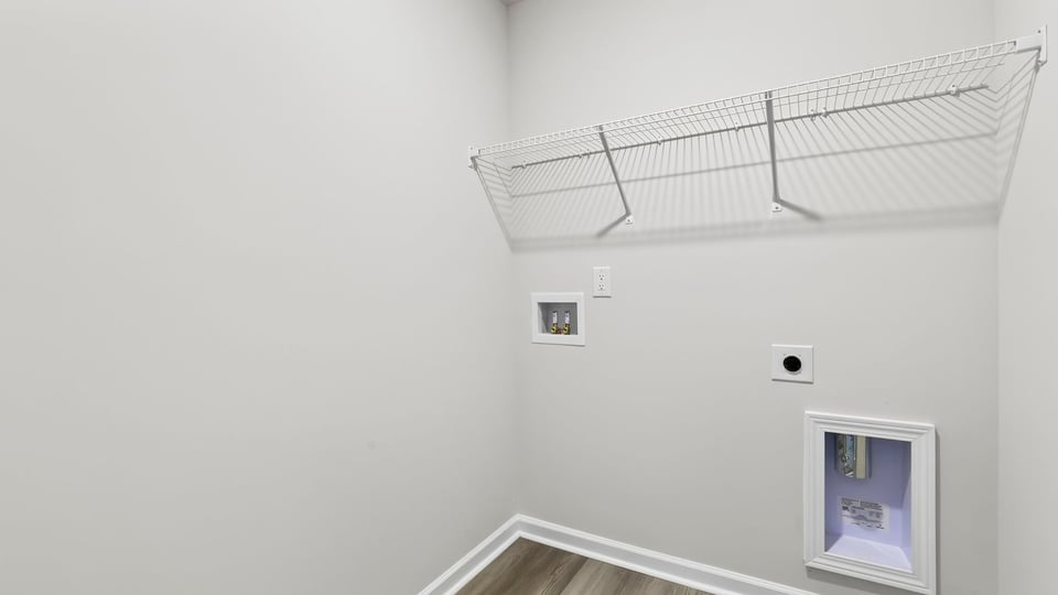 Laundry room with shelf.