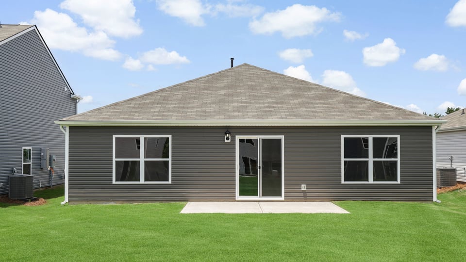 Back exterior with large backyard.
