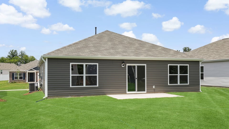 Back exterior with large backyard.