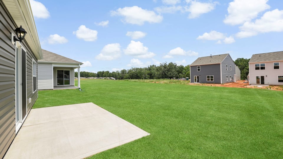 Back exterior with large backyard.