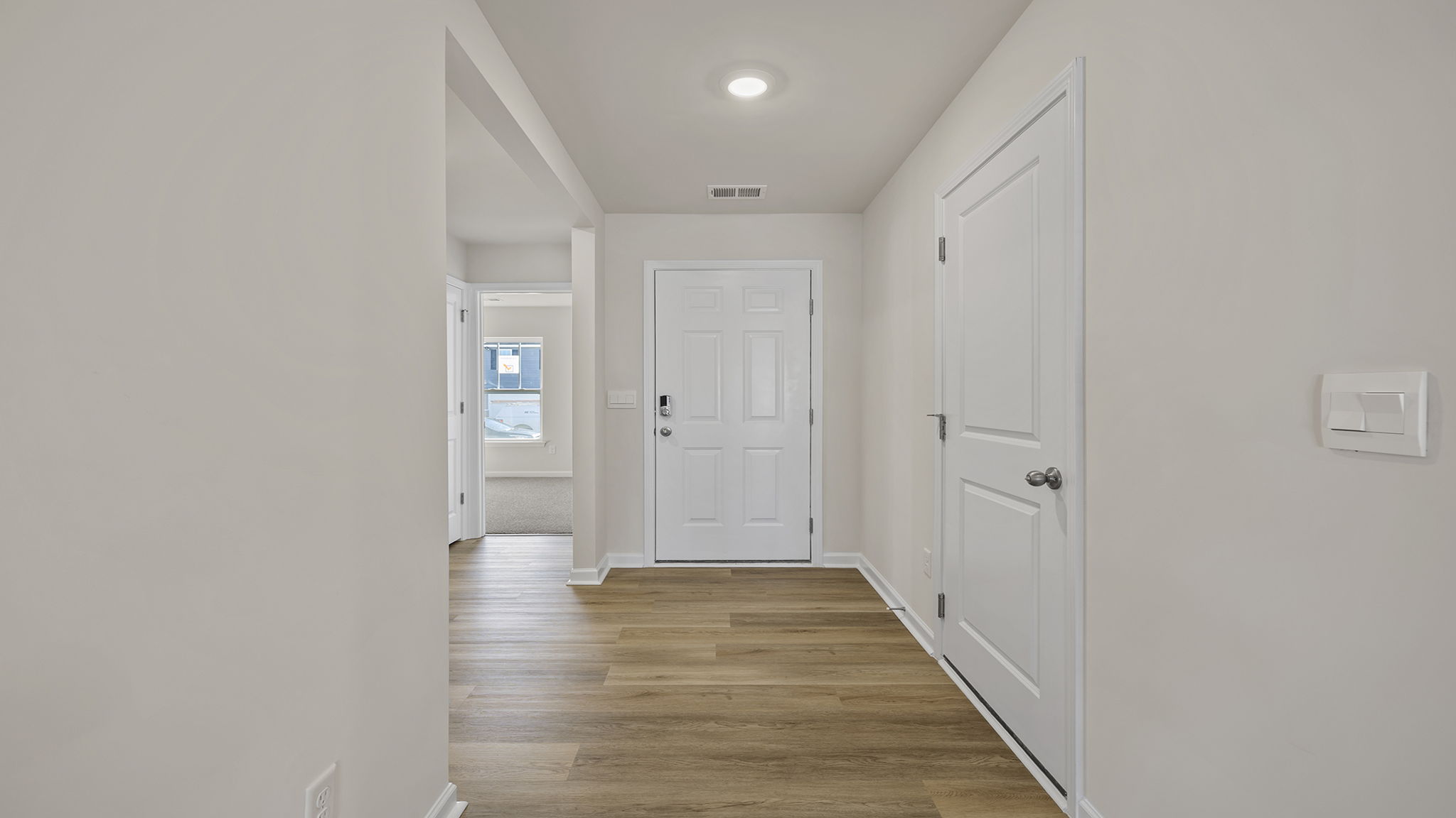 View of entrance and front bedroom.