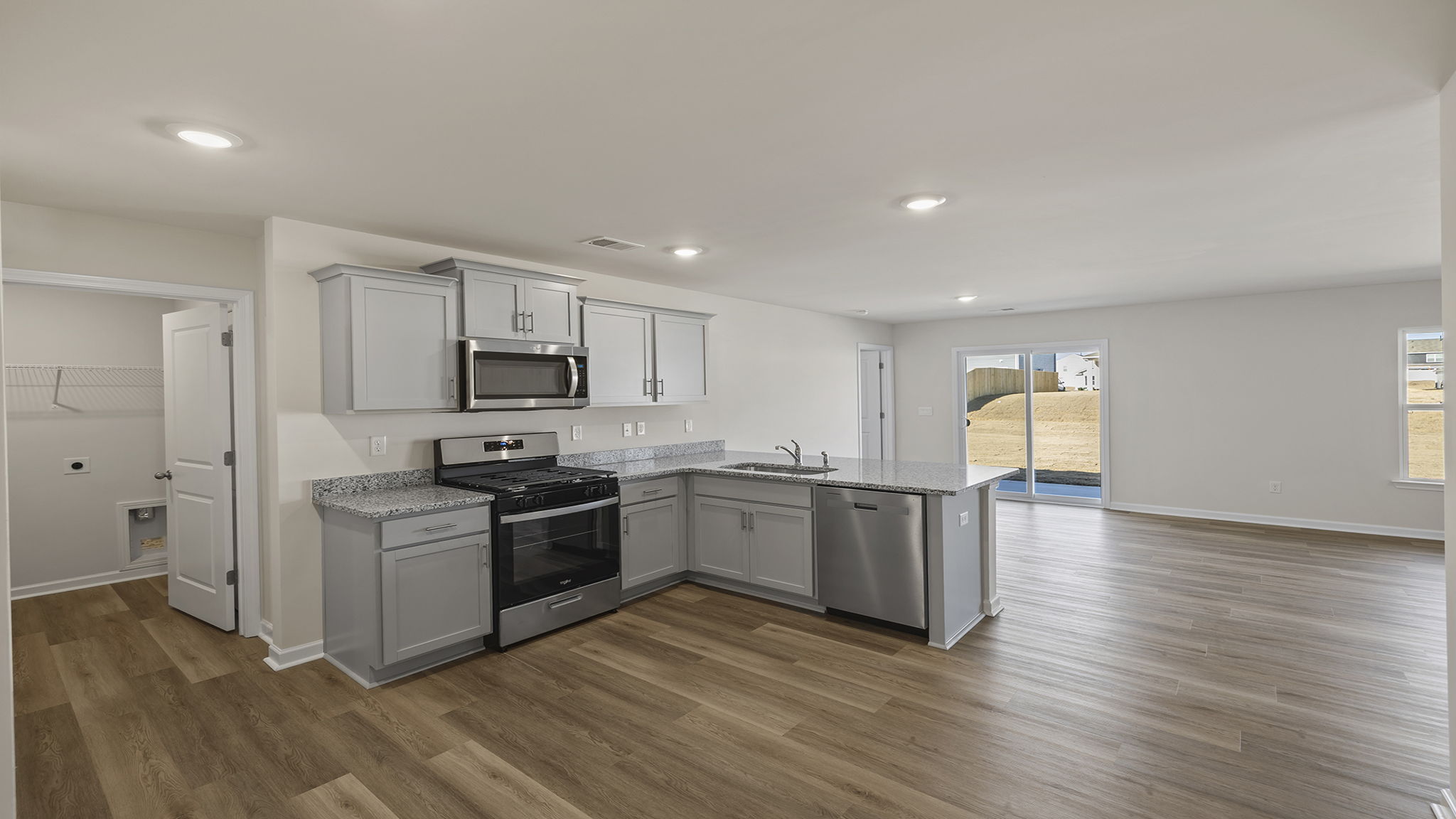 View of kitchen and open floor plan.