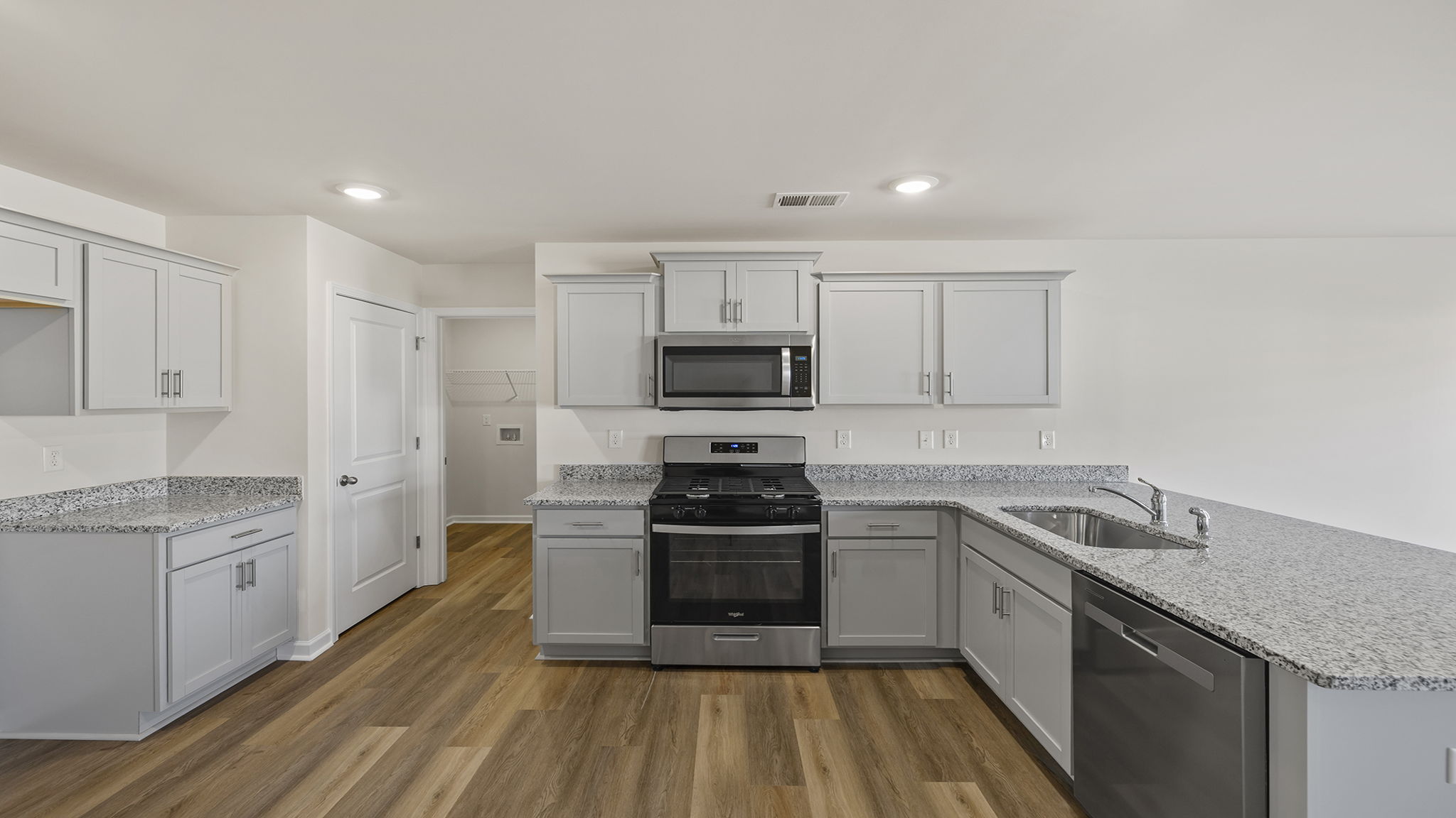 Kitchen has stainless steel appliances.