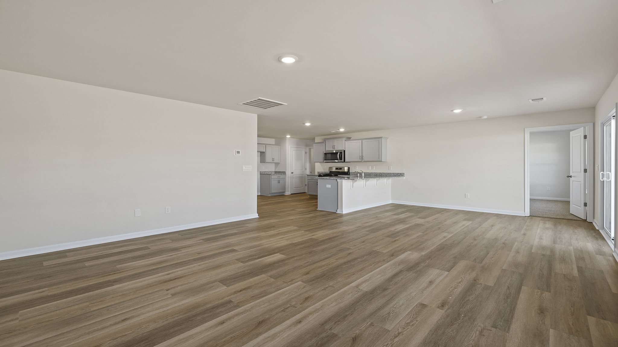 View from family room toward the kitchen and dining area.