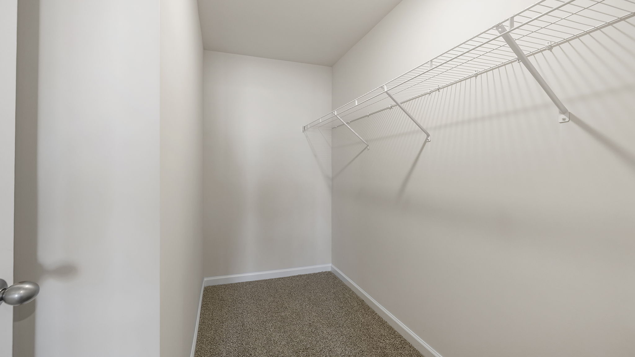 Primary bedroom walk-in closet.