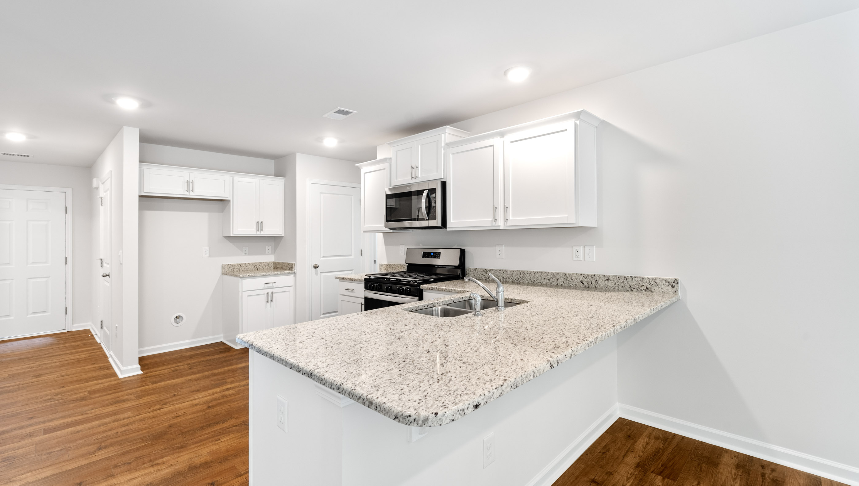 Kitchen with granite counter tops.