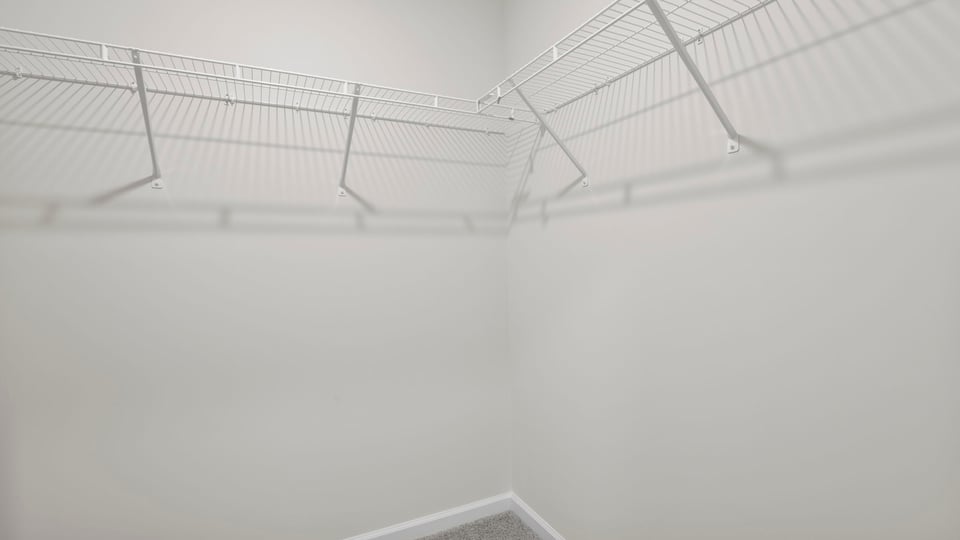 Primary bedroom walk in closet.